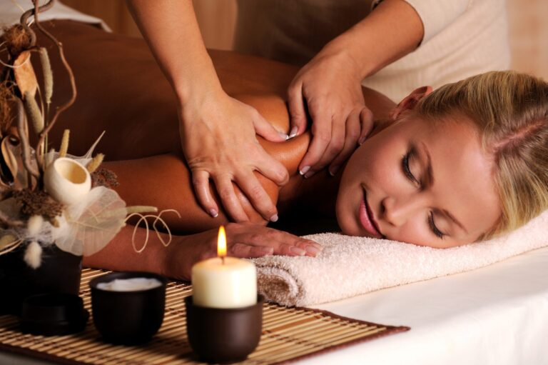 masseur-doing-massage-female-shoulder-beauty-salon-scaled